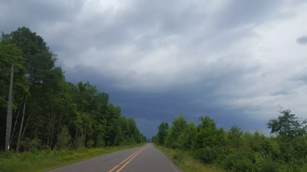 Bad weather cycling on Gibbs City Road north or Iron River Michigan.
