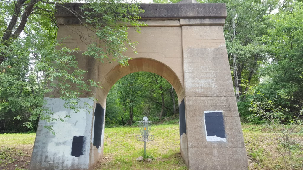 The Tailings Disc Golf Course has ruins from a century ago in Iron River Michigan along the Apple Blossom Trail.