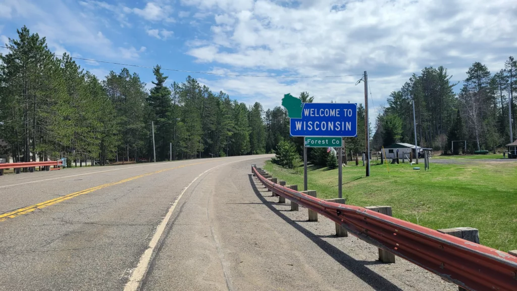 Wisconsin side of HWY 55 crossing the Brule River from Michigan HWY 73