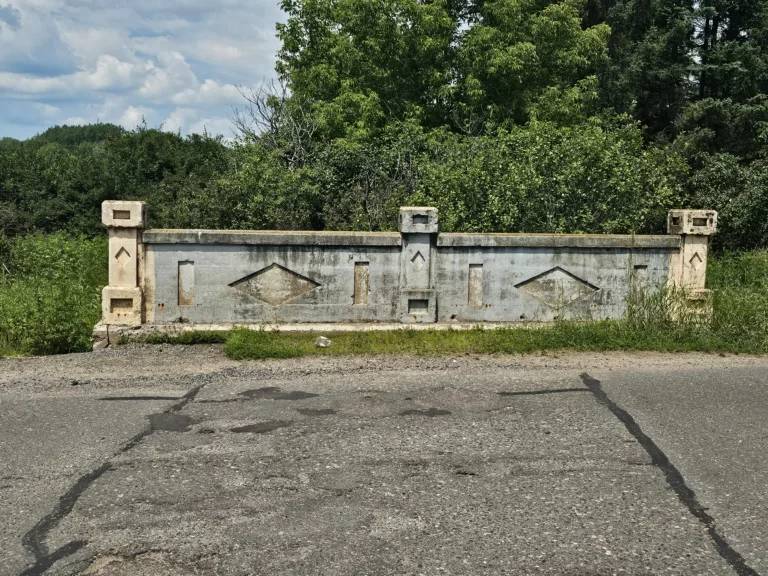 Old bridge outside of Caspian Michigan over a creek by Caspian Pond.