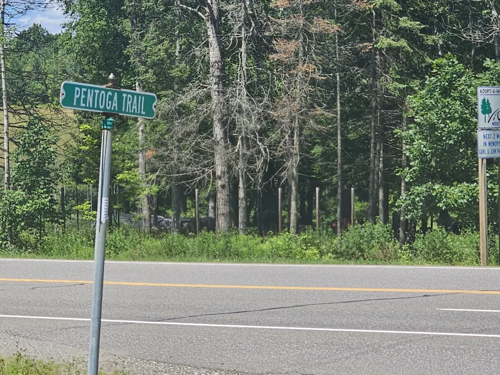 The street sign for Pentoga Trail on US2. This is the end of three segments of the Pentoga Trail-Road sections. North section is US2 to 424. Middle Section is 424 to Pentoga Village and Brule River. Start section is gravel and ends in Wisconsin on the forest road 2443 leading into the Chequamegon-Nicolet National Forest north of HWY 70 in Florence county and starting at the Brule River.