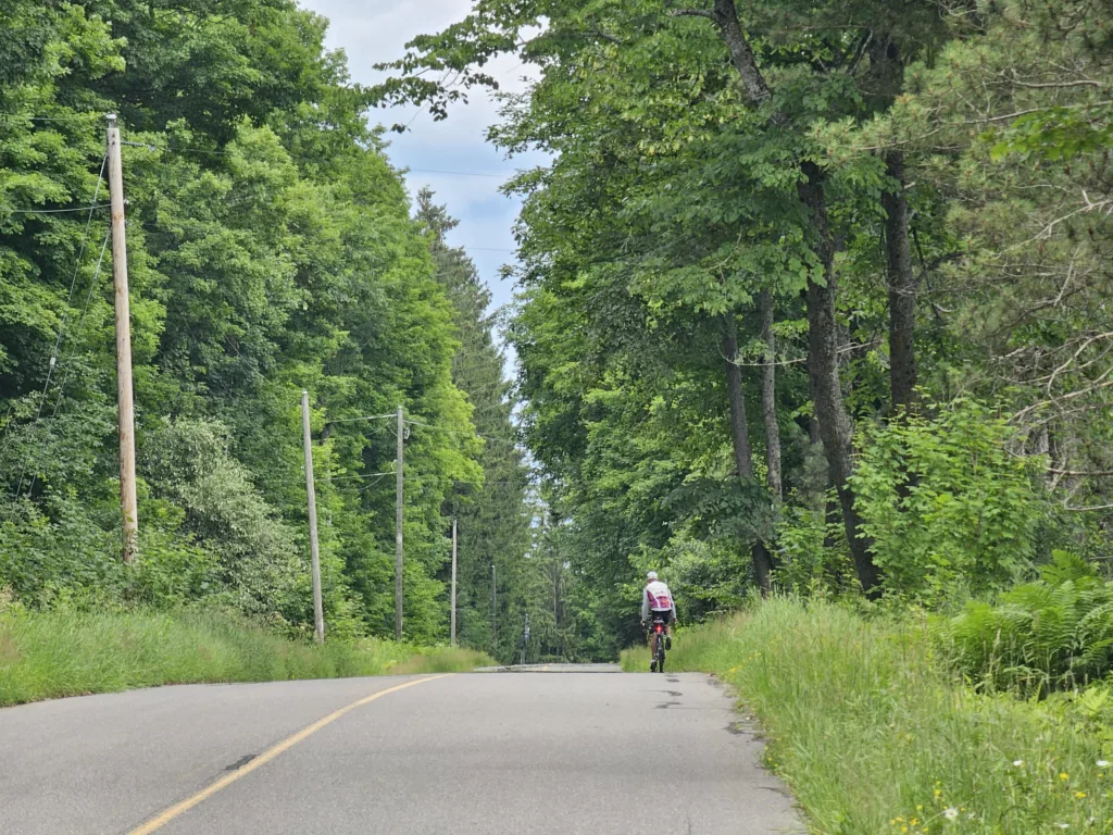Cycling in July on Wagner Lake Road.
