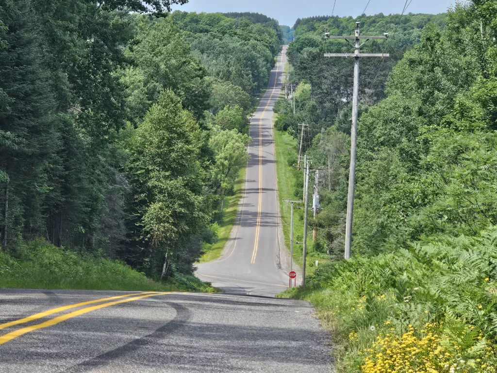 The big hill at the end of West Division Street out of Iron River. Above HWY 73 at the stop sign. Lake Ottawa Road beyond leads to Ottawa Lake, Hagerman Lake and Brule Lake headwaters of the Brule River.